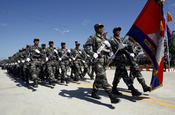 Cambodian military take part in a parade on the outskirts of Phnom Penh