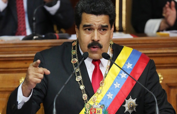 Venezuela's President Nicolas Maduro, speaks during the annual state-of-the-nation address at the National Assembly in Caracas, Venezuela, Wednesday, Jan 21, 2015. President Nicolas Maduro acknowledged the economic crisis wracking Venezuela during his annual address Wednesday night, but did not announce the reforms many had expected. (AP Photo/Ariana Cubillos)