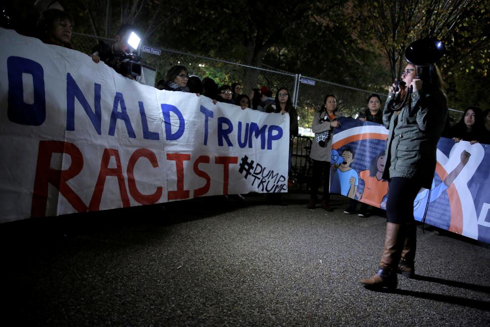 Hispanic demonstrators protest in front of the White House in Washington. REUTERS/Joshua Roberts