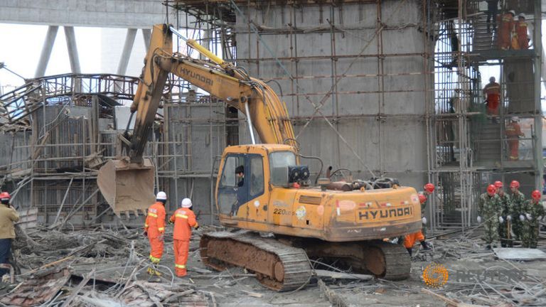 rescue-workers-search-at-the-site-where-a-power-plant-s-cooling