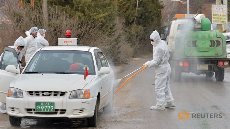 south-korean-health-officials-disinfect-a-vehicle-to-prevent