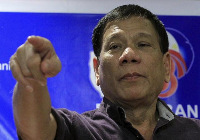 Rodrigo Duterte, a seven-term Philippine mayor, gestures while making a point during a ceremony proclaiming him as a presidential candidate at a hotel in Manila November 30, 2015. REUTERS/Romeo Ranoco