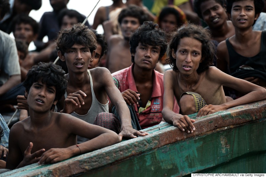 Rohingya migrants sit on a boat drifting in Thai waters off the southern island of Koh Lipe in the Andaman sea on May 14, 2015.  The boat crammed with scores of Rohingya migrants -- including many young children -- was found drifting in Thai waters on May 14, according to an AFP reporter at the scene, with passengers saying several people had died over the last few days.     AFP PHOTO / Christophe ARCHAMBAULT        (Photo credit should read CHRISTOPHE ARCHAMBAULT/AFP/Getty Images)