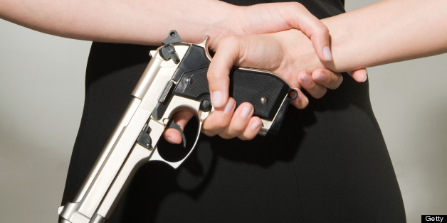 A woman concealing a gun