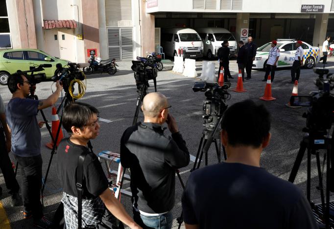 Cameramen stand outside the morgue at Putrajaya hospital in Malaysia February 15, 2017. REUTERS/Edgar Su