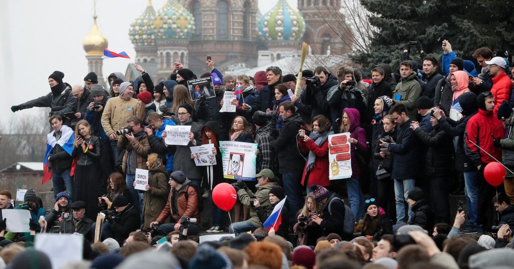 Protesters gather at Marsivo Field in St.Petersburg, Russia, Sunday, March 26, 2017. Thousands of people crowded in St.Petersburg on Sunday for an unsanctioned protest against the Russian government, the biggest gathering in a wave of nationwide protests that were the most extensive show of defiance in years. (AP Photo/Dmitri Lovetsky)